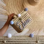 Personalized Handwoven Palm Leaf Vanity Basket with Pom-Poms – Baby Storage Organizer - Image 3