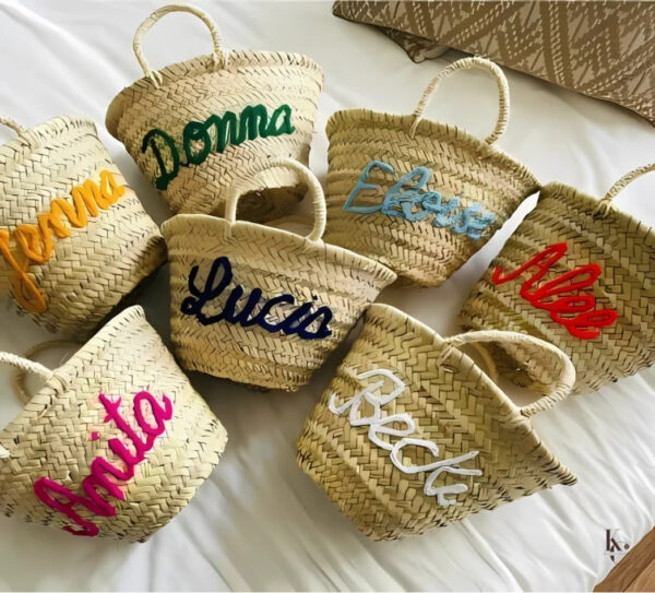 Discover this handmade Moroccan straw basket, crafted with lightweight, durable natural straw for a timeless and elegant design. Perfect as a market bag, beach tote, home décor storage, or stylish interior accent. Each basket is handcrafted by skilled artisans, preserving traditional Moroccan craftsmanship passed down for generations. Dimensions: Height 29 cm, Base Width 11 cm, Top Width 18 cm. Make it uniquely yours: add a custom text or design in the comments to personalize your basket. A boho-chic accessory that blends nature, sophistication, and individuality.